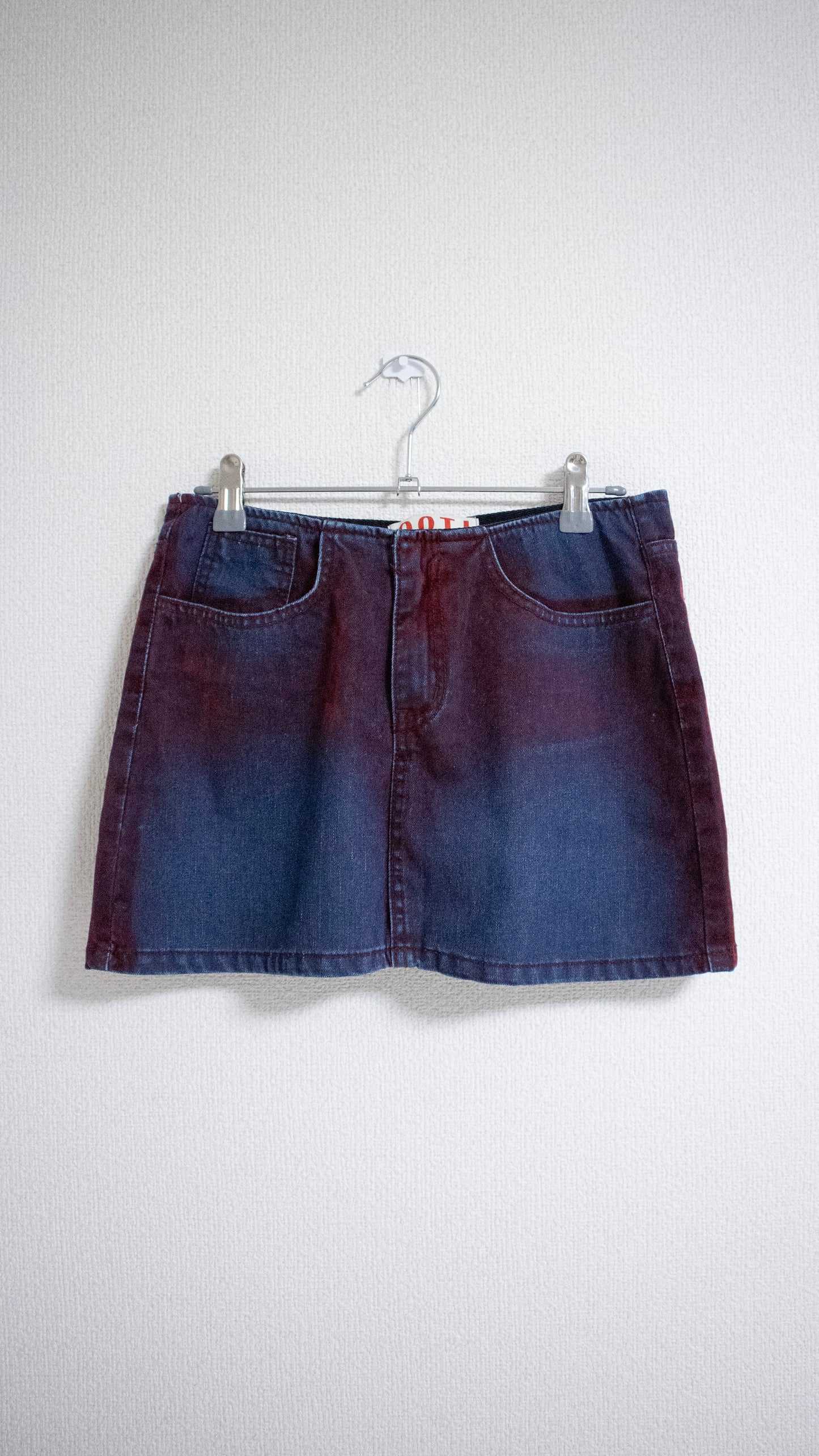 Painted denim mini skirt